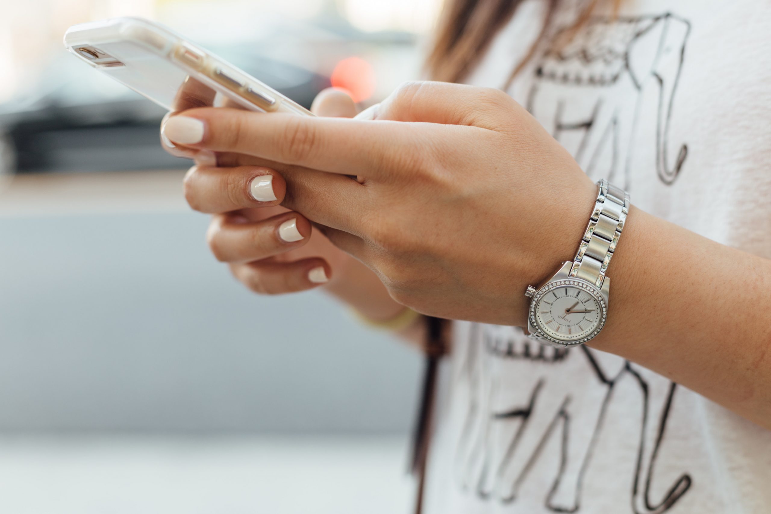 Girl using mobile device for SMS